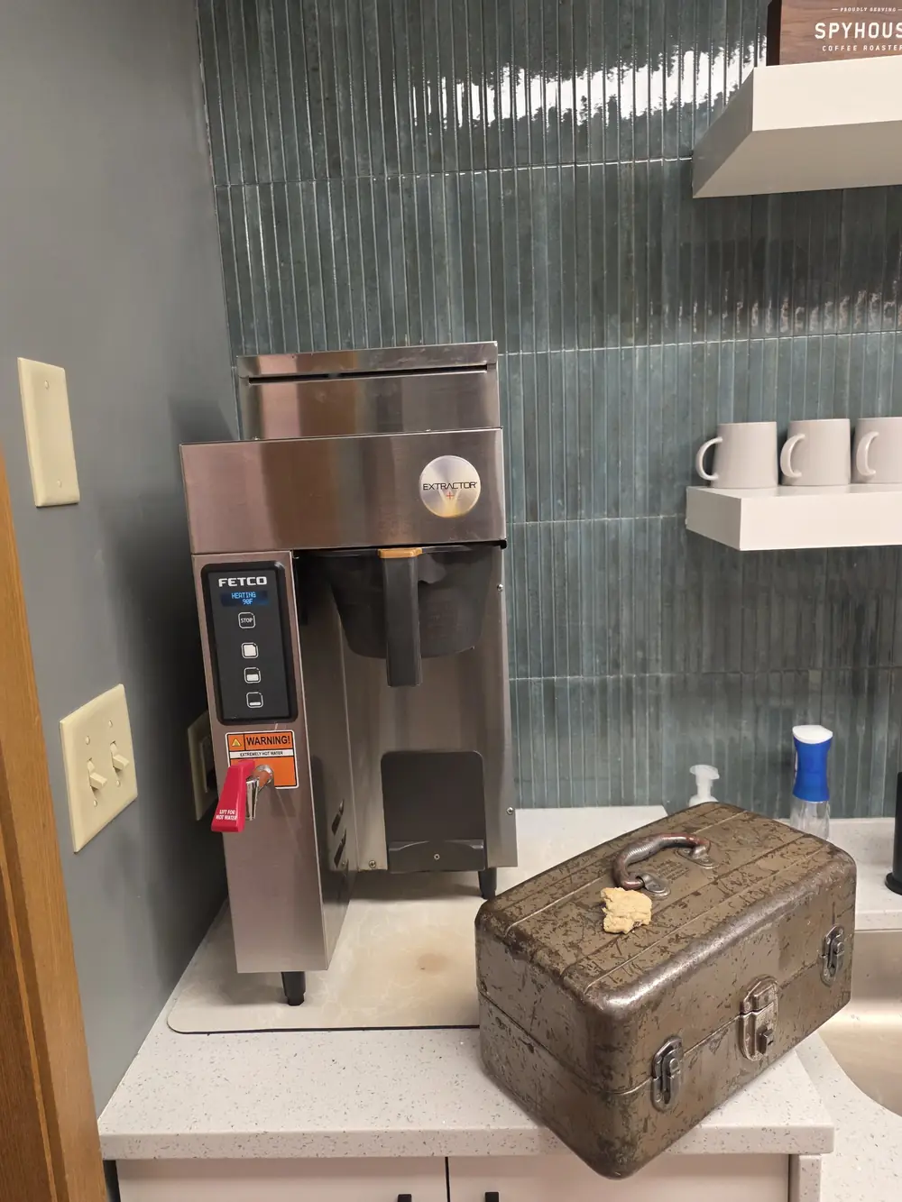Fetco commercial batch coffee brewer repaired at a coworking space in Richfield, Minnesota